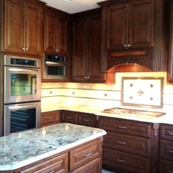 Interiors of kitchen cabintes are solid maple veneer and solid maple facing