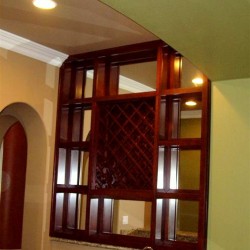 Built in wine racks with mirrored backing