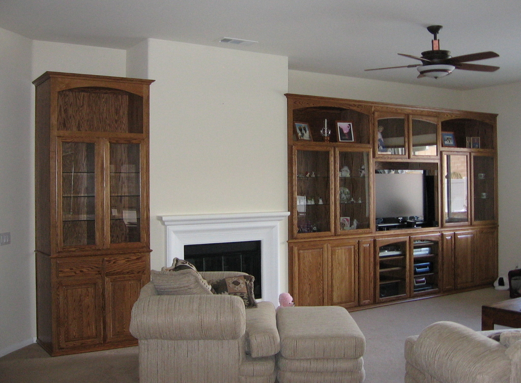 Built in wall unit in niches next to fireplace. | C & L Design Specialists Inc