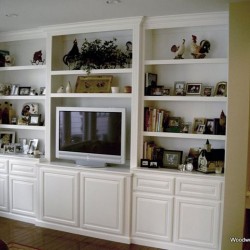 Custom built in wall unit in white lacquer