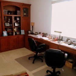 A beautiful working home office. Designed in 2010. A stunning display cabinet is just right for family photos in this South Redlands home.