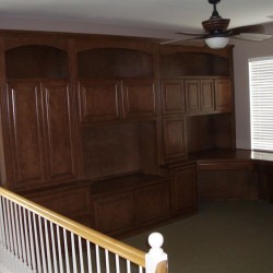 Custom built in home office with corner desk and bookshelves.
