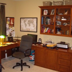 Maple home office with built in corner desk and upper bookshelves