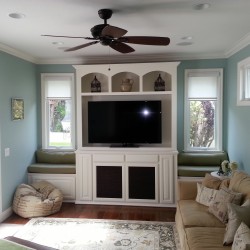 Pretty white wall unit with dual window seats