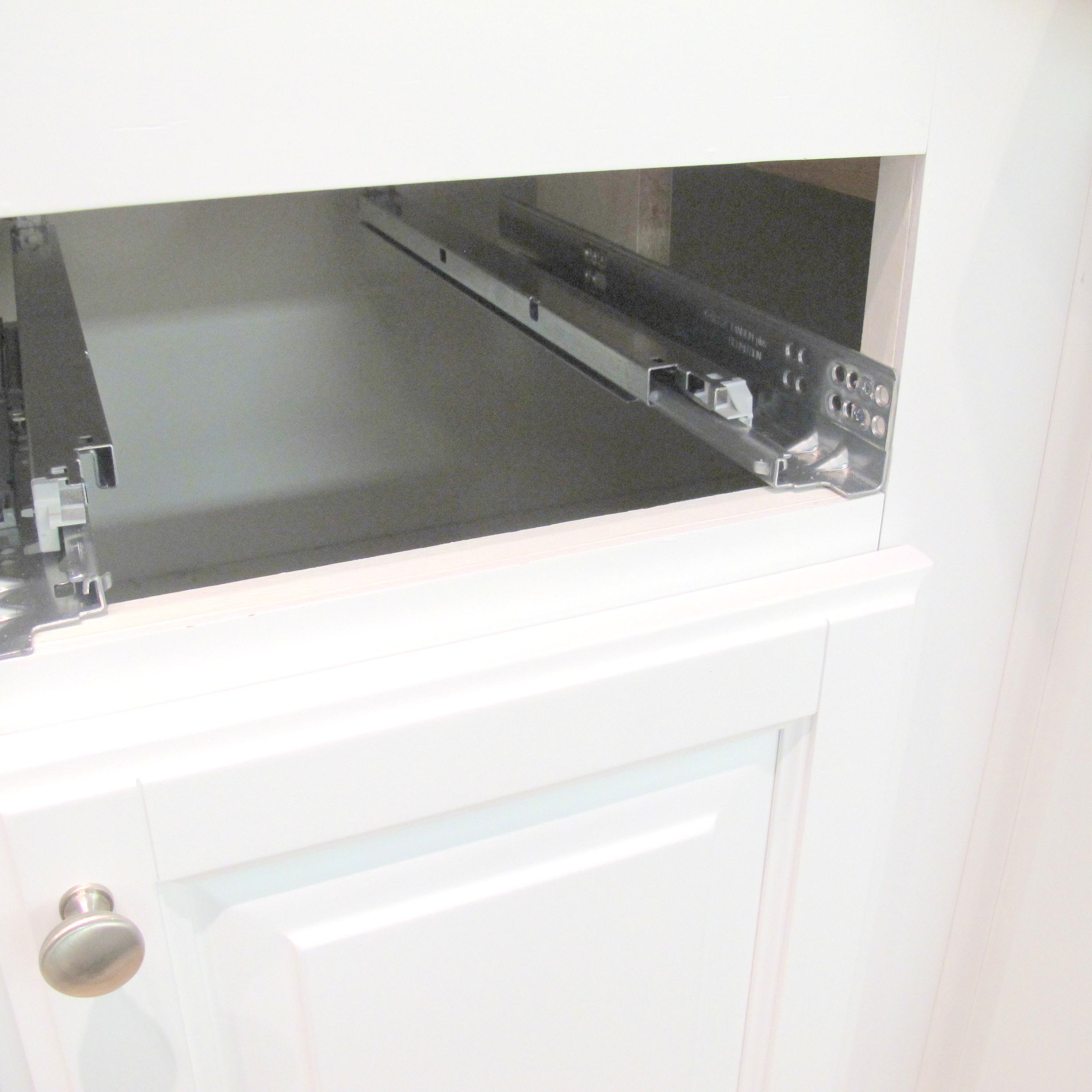 Full extension drawer glides getting installed C & L Design Specialists