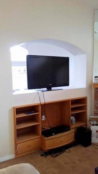 Before wall unit installation - a hole in the wall into the adjoining room.